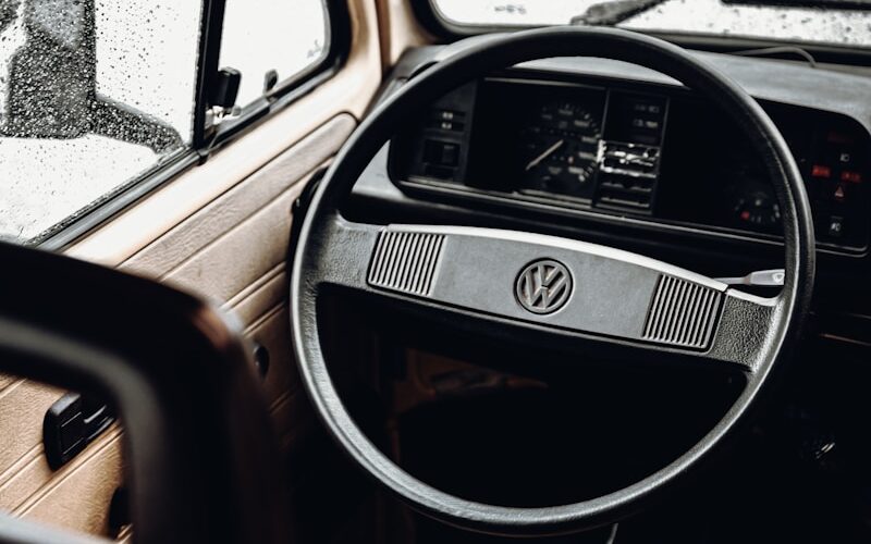shallow focus photo of black Volkswagen steering wheelk